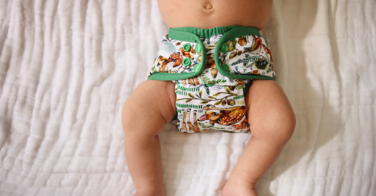 baby wearing fit cloth diaper to prevent diaper blowout